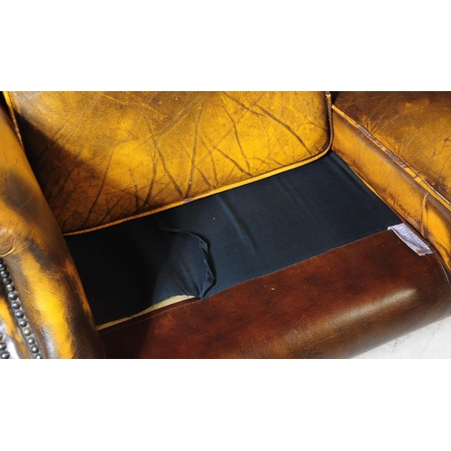 935 - Chesterfield style - A 20th Century yellow leather Chesterfield manner wingback two seater sofa love... 