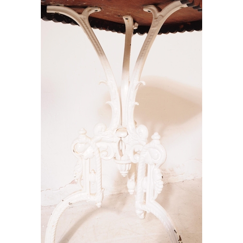 936 - A 19th century Coalbrookdale manner cast iron base side table. The tables white painted cast iron ba... 