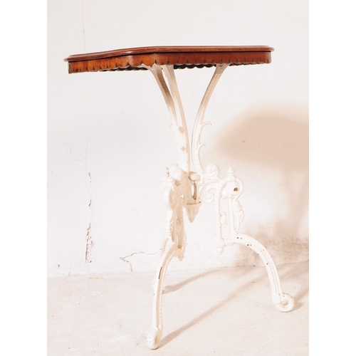 936 - A 19th century Coalbrookdale manner cast iron base side table. The tables white painted cast iron ba... 