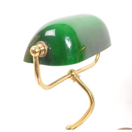 938 - Two contemporary bankers lamps. One with green glass shade on  brass style arm and circular stepped ... 