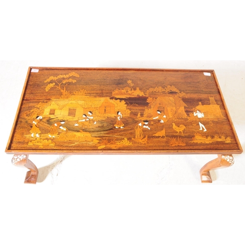 943 - A 20th century Indian bone inlaid coffee / side table. The table raised on short cabriole legs, with... 