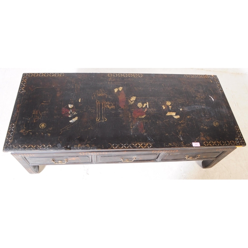 944 - A 20th century Chinese low inlaid ebonised black lacquered chinoiserie coffee / tea table. The table... 