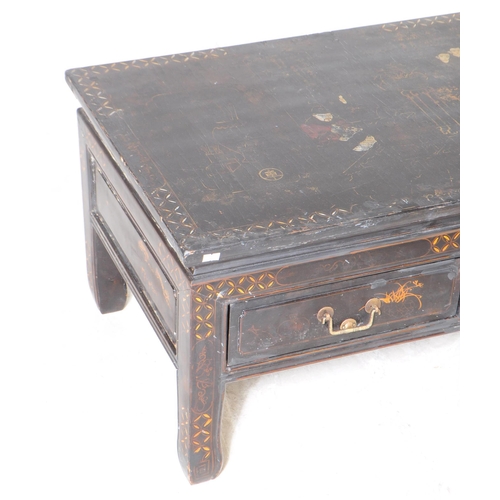 944 - A 20th century Chinese low inlaid ebonised black lacquered chinoiserie coffee / tea table. The table... 