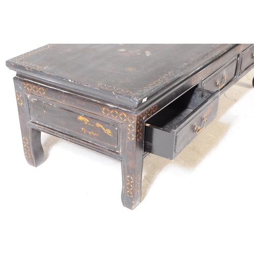 944 - A 20th century Chinese low inlaid ebonised black lacquered chinoiserie coffee / tea table. The table... 