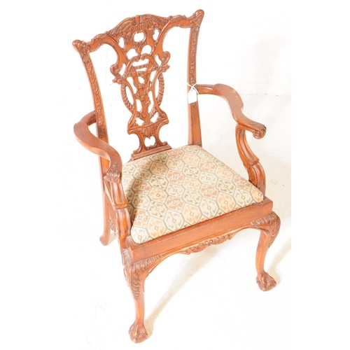 945 - An early 20th century Chippendale revival mahogany childs dining carver armchair. The chair raised o... 