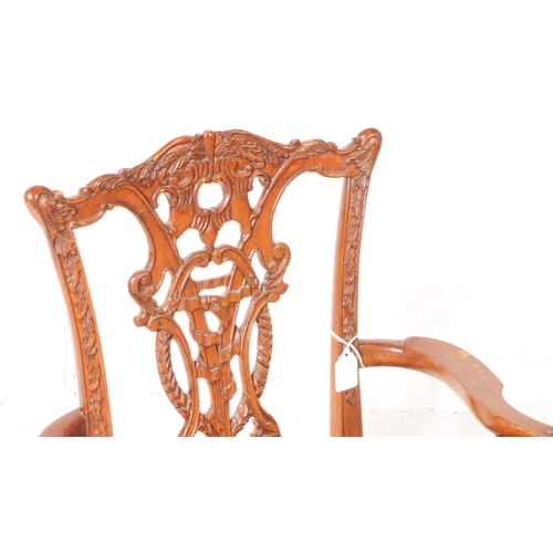 945 - An early 20th century Chippendale revival mahogany childs dining carver armchair. The chair raised o... 