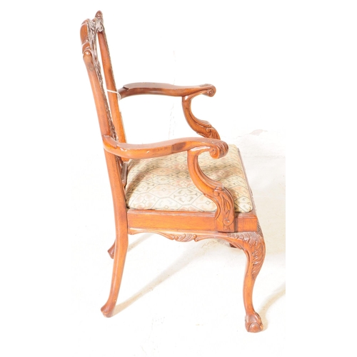 945 - An early 20th century Chippendale revival mahogany childs dining carver armchair. The chair raised o... 