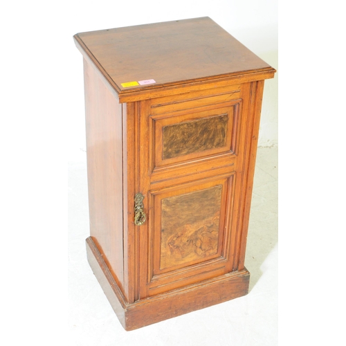 953 - A 19th century Victorian walnut pot cupboard. The pot cupboard raised on a plinth base, with a singl... 