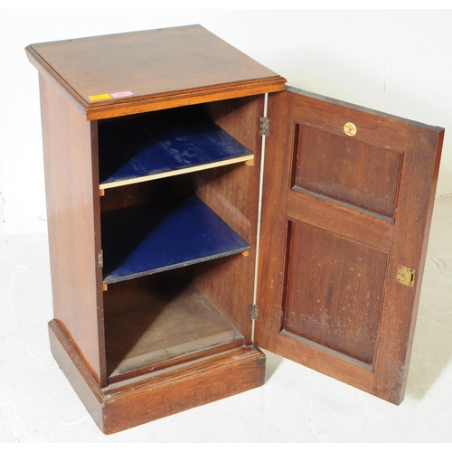 953 - A 19th century Victorian walnut pot cupboard. The pot cupboard raised on a plinth base, with a singl... 