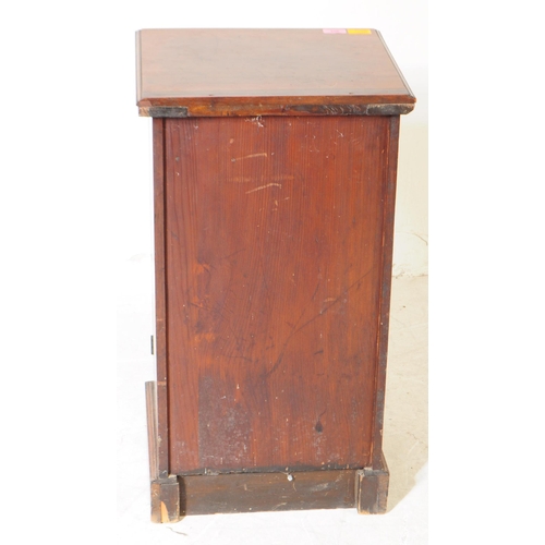 953 - A 19th century Victorian walnut pot cupboard. The pot cupboard raised on a plinth base, with a singl... 