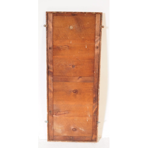 960 - A large 19th century mahogany shop / haberdashery wall mirror. The mirror of rectangular form mounte... 