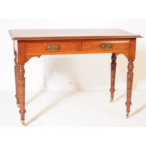 962 - A 19th century Victorian mahogany writing desk / console hall table. The table raised on tapered tur... 