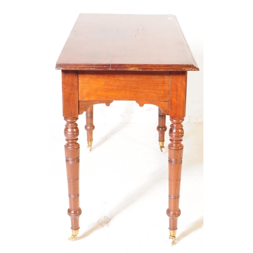 962 - A 19th century Victorian mahogany writing desk / console hall table. The table raised on tapered tur... 