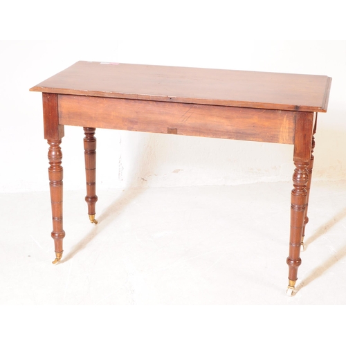 962 - A 19th century Victorian mahogany writing desk / console hall table. The table raised on tapered tur... 