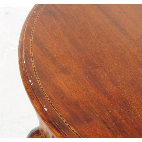 964 - An Edwardian walnut veneer marquetry inlaid low coffee side table. The table of round form, with mar... 