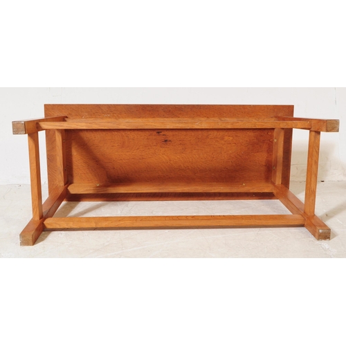 974 - A vintage 20th century shaker style solid oak bench / table. Rectangular form with upright square le... 