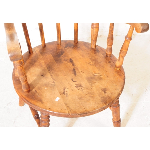 975 - A 20th century farmhouse elm spindle back penny seat Windsor armchair. With stick-back, turned suppo... 