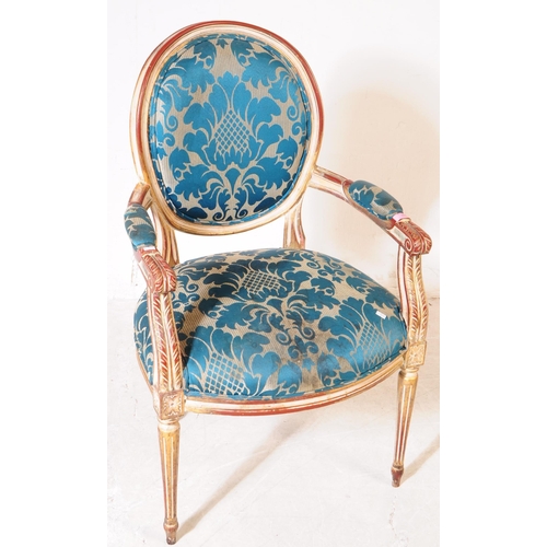 986 - A Louis XVI manner giltwood salon armchair. The chair raised on tapered fluted legs to front, having... 