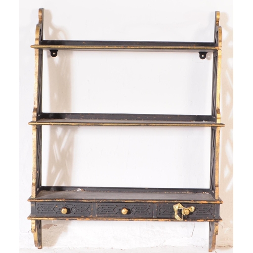 987 - A 20th century Chinoiserie manner wall hanging bookshelf. The bookshelf featuring a row of three car... 