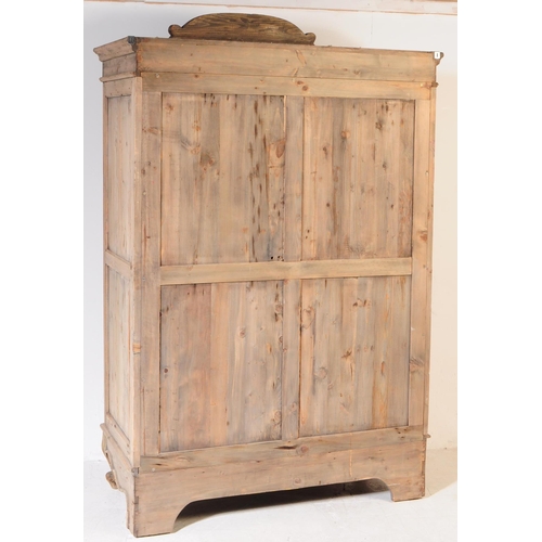 991 - A 20th century Louis XVI revival pine armoire wardrobe. Raised on cabriole legs to front, with a sha... 