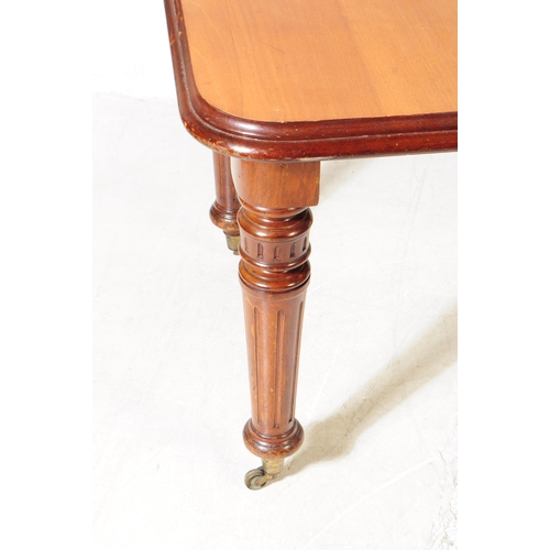 993 - A 19th century Victorian mahogany wind out dining table. The table raised on tapered turned legs, wi... 