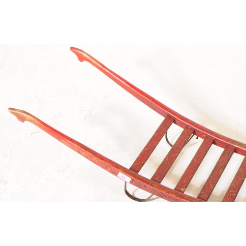 994 - A late 19th century Victorian red lacquered sack barrow. The barrow having a single wheel to front, ... 