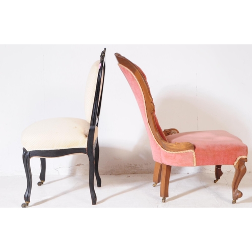 996 - A 19th century Victorian walnut ladies spoon back nursing chair, alongside another. The chair having... 