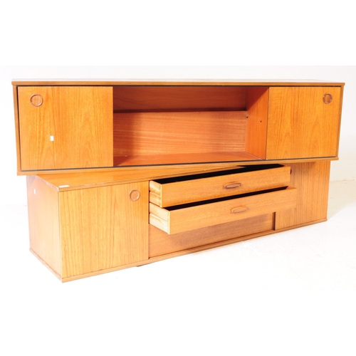 665 - Avalon - A retro mid 20th century teak Ladderax shelving wall system. The two sideboard cabinets of ... 