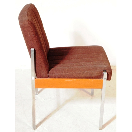 672 - Antocks Lairn - A mid 20th century retro armchair. Having a brown fabric padded backrest and seat on... 