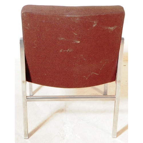 672 - Antocks Lairn - A mid 20th century retro armchair. Having a brown fabric padded backrest and seat on... 