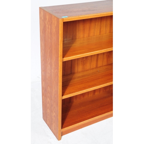 676 - British Modern Design - A mid 20th century circa 1970s teak open bookcase display case. The bookcase... 