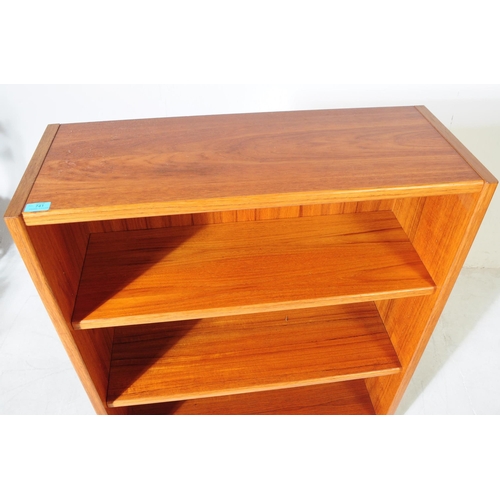 676 - British Modern Design - A mid 20th century circa 1970s teak open bookcase display case. The bookcase... 