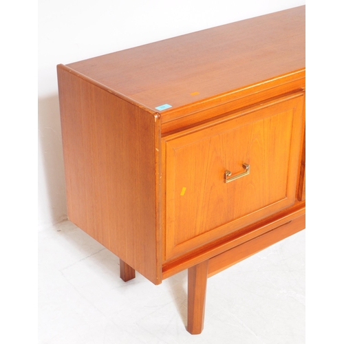 679 - British Modern Design - A retro mid 20th century teak sideboard credenza. Rectangular form with a ba... 