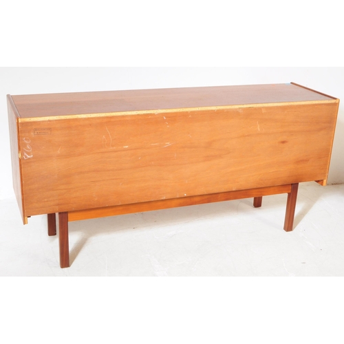 679 - British Modern Design - A retro mid 20th century teak sideboard credenza. Rectangular form with a ba... 