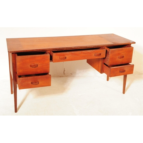 680 - Younger Furniture - A 20th century teak dressing / writing table desk. Rectangular form with flared ... 