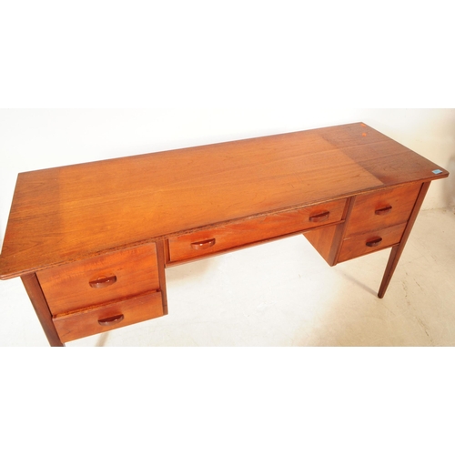 680 - Younger Furniture - A 20th century teak dressing / writing table desk. Rectangular form with flared ... 