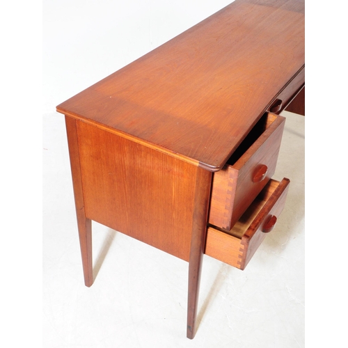 680 - Younger Furniture - A 20th century teak dressing / writing table desk. Rectangular form with flared ... 