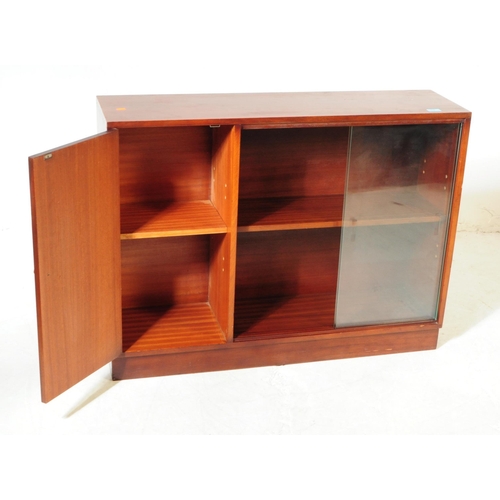 682 - British Modern Design - A late 20th century mahogany veneered bookcase cabinet. Rectangular form wit... 