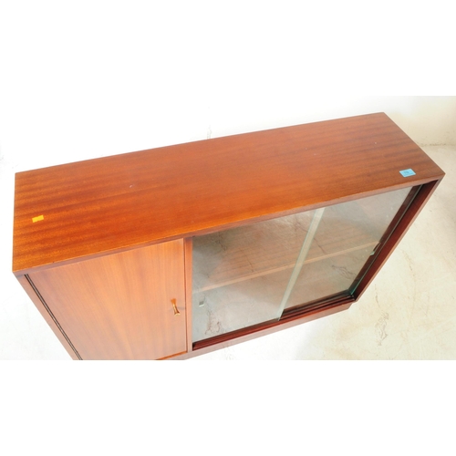 682 - British Modern Design - A late 20th century mahogany veneered bookcase cabinet. Rectangular form wit... 