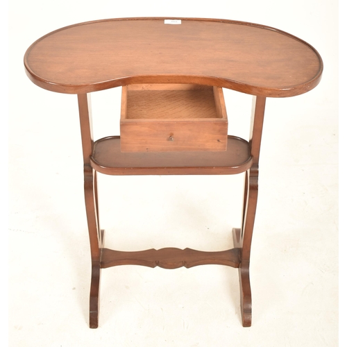 909 - A 19th century French mahogany kidney side table. The table having kidney top and being raised over ... 