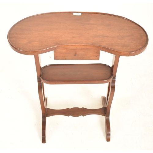 909 - A 19th century French mahogany kidney side table. The table having kidney top and being raised over ... 