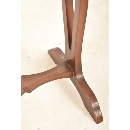 909 - A 19th century French mahogany kidney side table. The table having kidney top and being raised over ... 