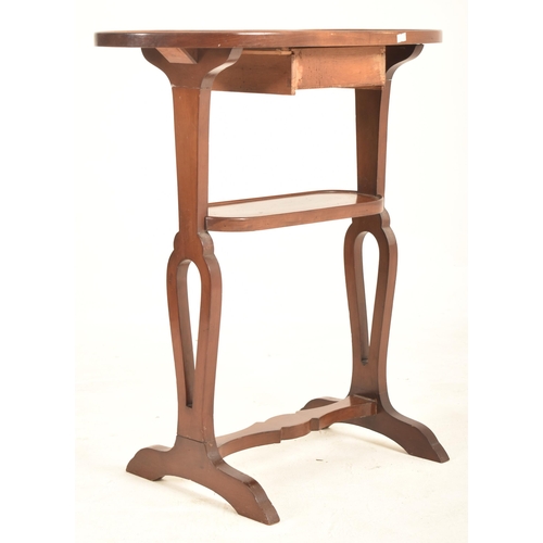 909 - A 19th century French mahogany kidney side table. The table having kidney top and being raised over ... 