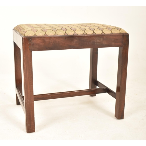 959 - A George III 18th century mahogany upholstered piano / foot stool. The stool having a padded upholst... 