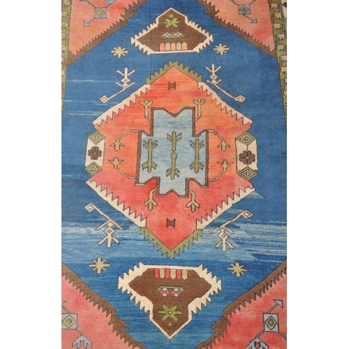 966 - A mid 20th century Anatolian Turkish Kars style carpet floor rug. The carpet featuring a large centr... 