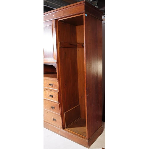 967 - A large Edwardian oak wood compactum wardrobe. Of rectangular form with bank of drawers to centre wi... 