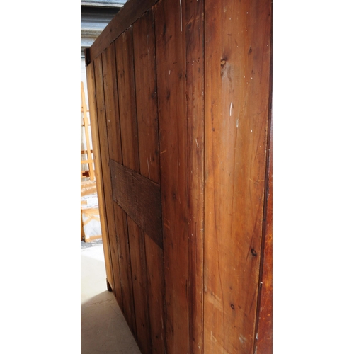 967 - A large Edwardian oak wood compactum wardrobe. Of rectangular form with bank of drawers to centre wi... 