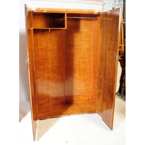 969 - Two 1930s Art Deco burr walnut wardrobe with tallboy. Having twin doors with bakelite and lucite han... 