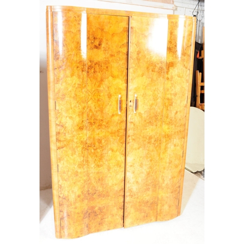 969 - Two 1930s Art Deco burr walnut wardrobe with tallboy. Having twin doors with bakelite and lucite han... 