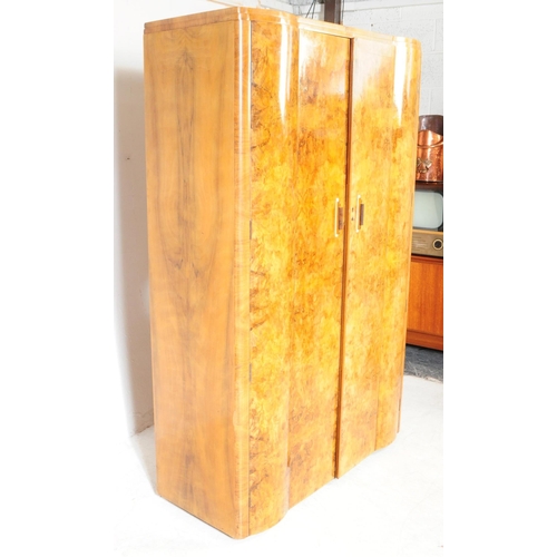 969 - Two 1930s Art Deco burr walnut wardrobe with tallboy. Having twin doors with bakelite and lucite han... 